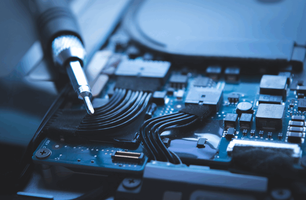 Computer hardware maintenance with a screwdriver inside a desktop computer
